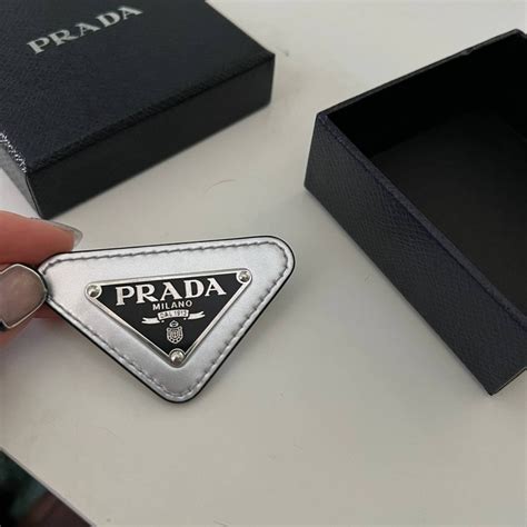 pins prada|prada triangular logo pin.